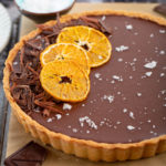 Chocolate-Orange Tart | Rich, chocolatey ganache tart w/ a hint of orange. Perfectly balanced w/ flaky sea salt & crumbly sweet tart crust. Elegant & scrumptious dessert for any holiday party! #chocolate #ganache #orange #baking #tart #seasalt #dessert #dessertrecipe #holidayrecipe #dinnerparty #christmas #partyrecipe | The Missing Lokness